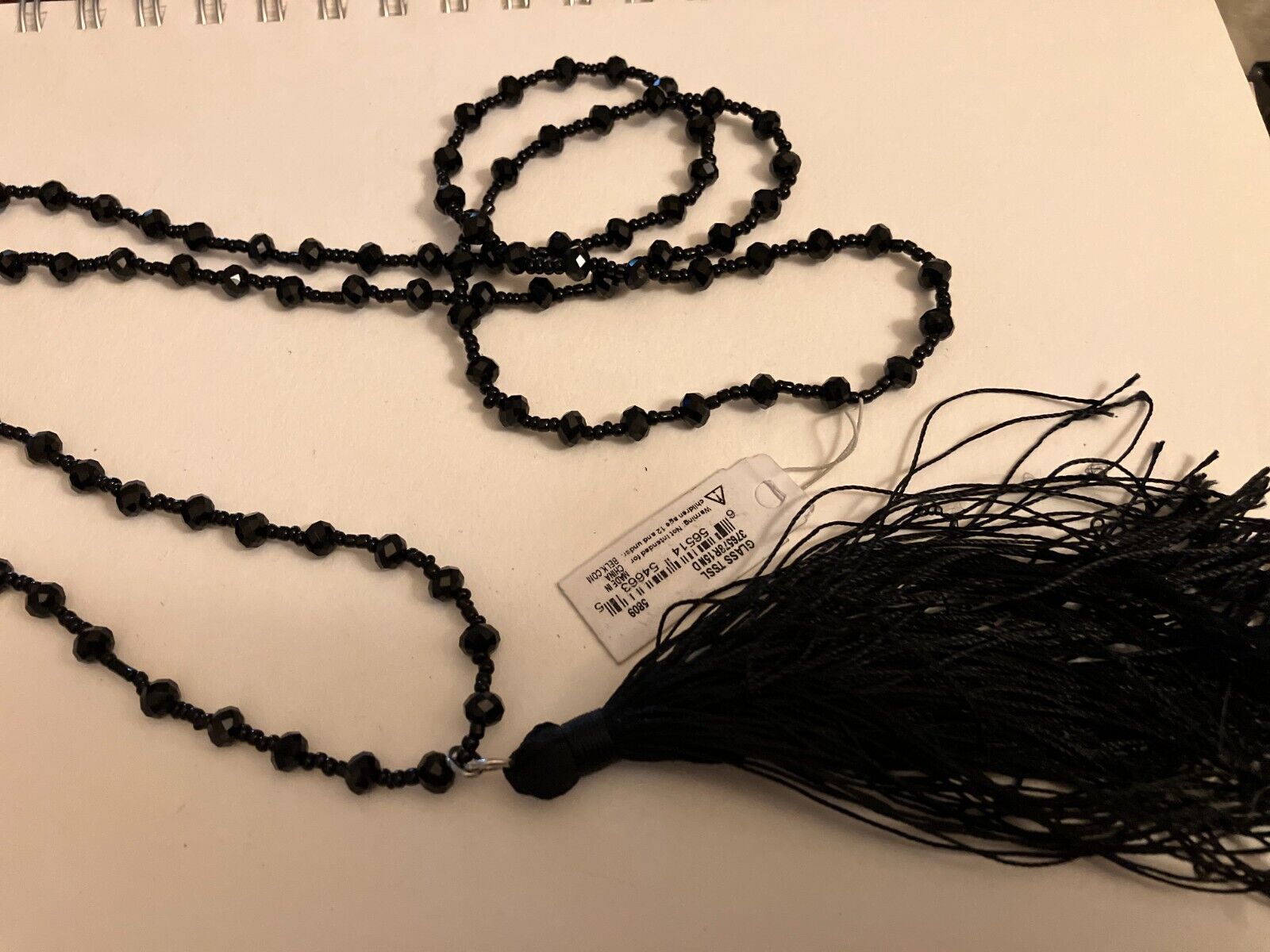new directions tassel pendant on glass bead NECKLACE