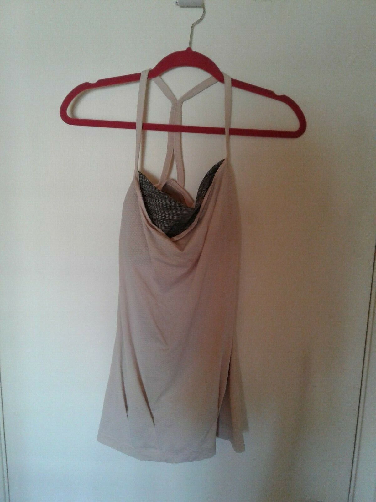 Prev. Owned lululemon light pink  long workout tank top size small 