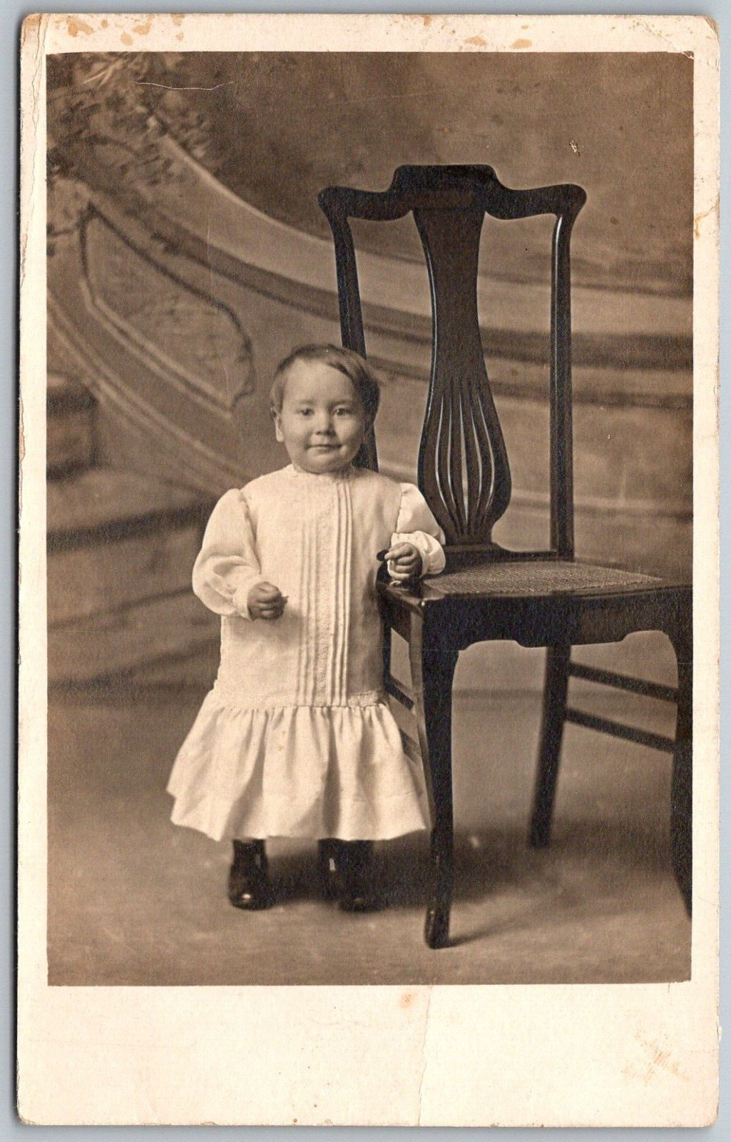 1910s RPPC Real Photo Postcard Baby Toddler Leaning On Chair