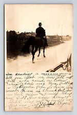 c1909 RPPC Man Derby Hat Riding Dark Horse Down Street Columbus IN Postcard picture