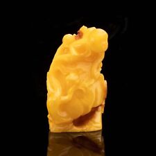 Carved Butterscotch Amber Monkey on Rock picture