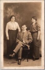 c1910s New York City Studio Photo RPPC Postcard Two Ladies w/ Man in Chair picture