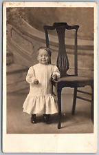 1910s RPPC Real Photo Postcard Baby Toddler Leaning On Chair picture