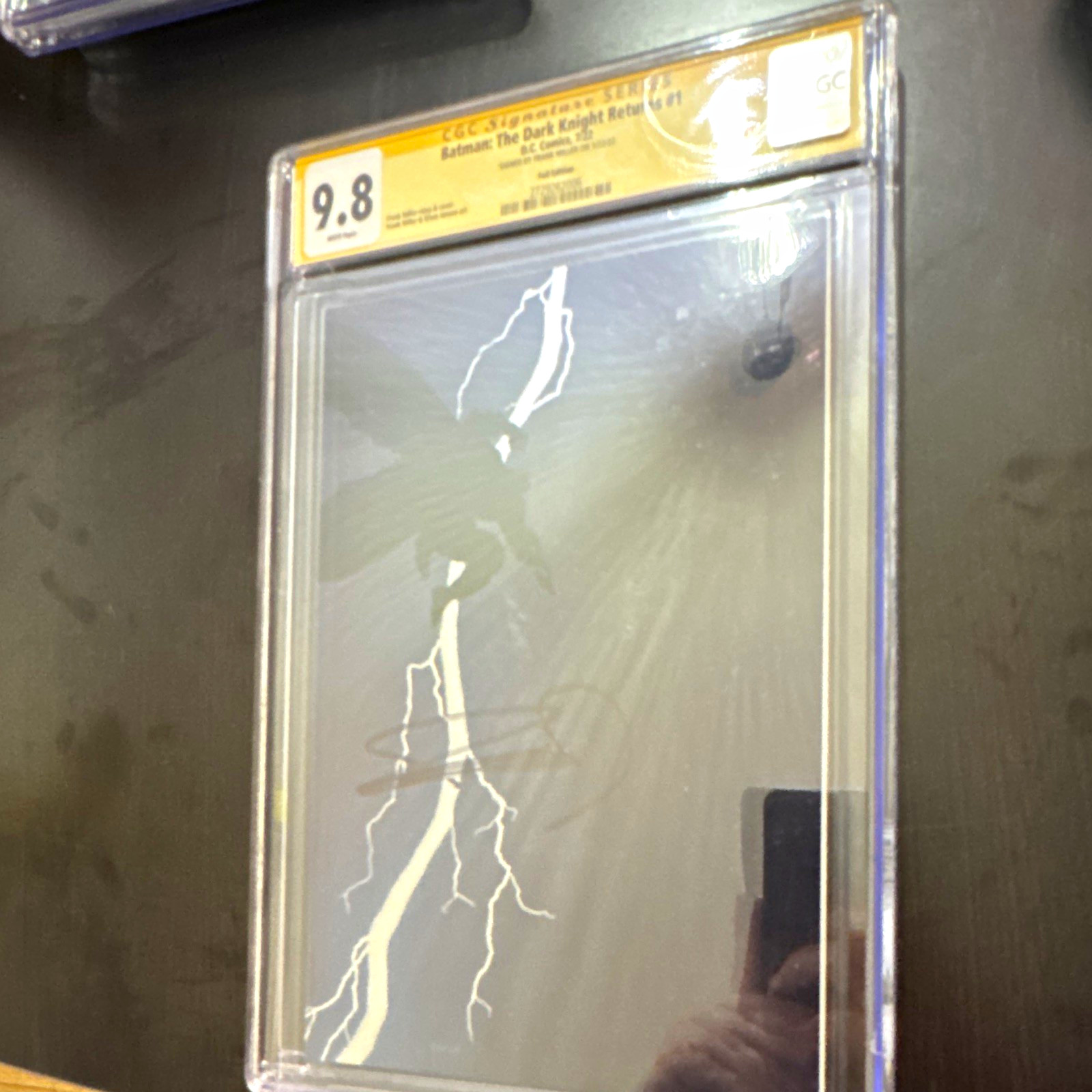 Batman: The Dark Knight Returns #1 - CGC 9.8 Signed Frank Miller (Foil Edition) Batman: The Dark Knight Returns #1 - CGC 9.8 Signed Frank Miller (Foil Edition)