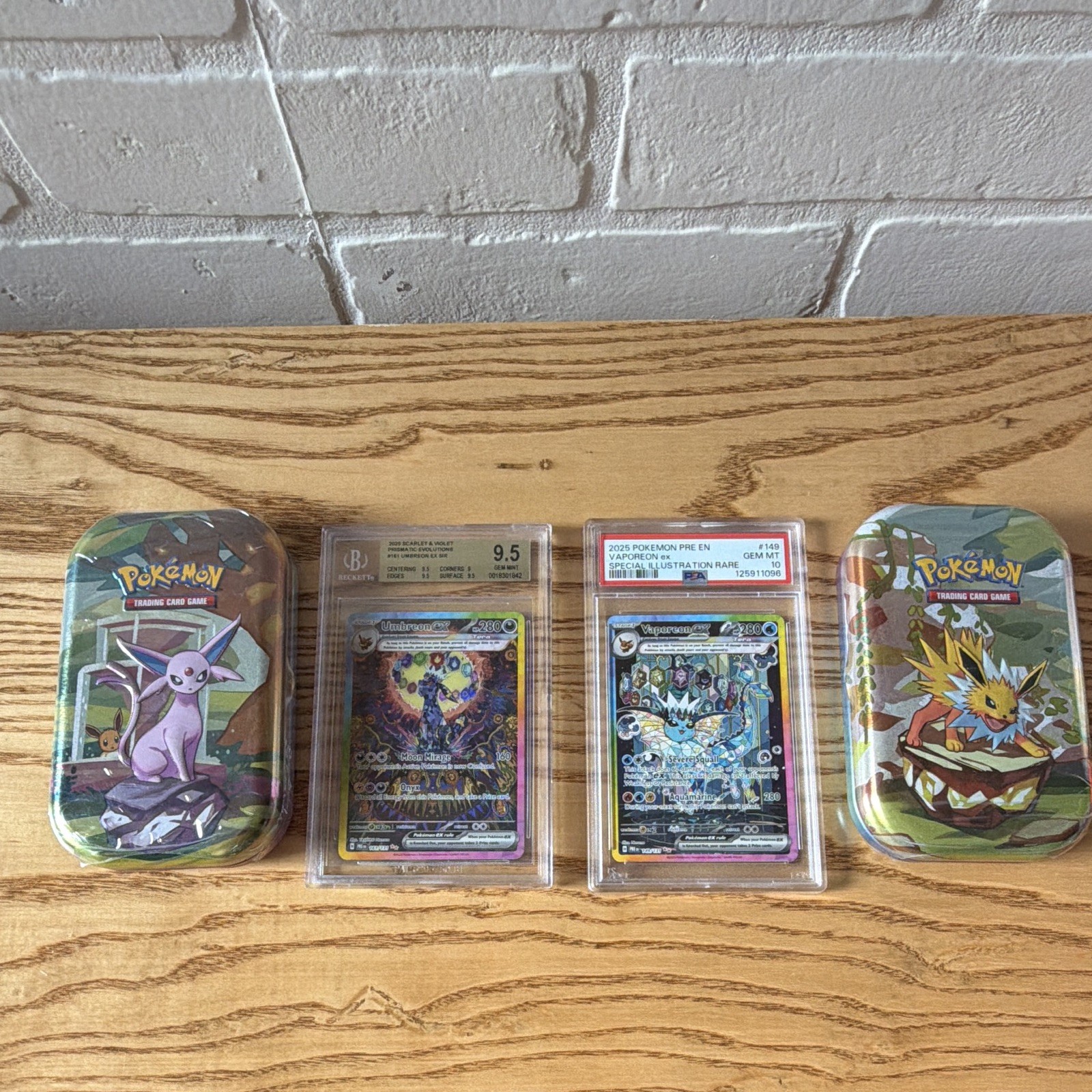 Prismatic Evolutions PSA 10 Vaporeon ex #149 BGS 9.5 Umbreon ex #161/ tins(2)