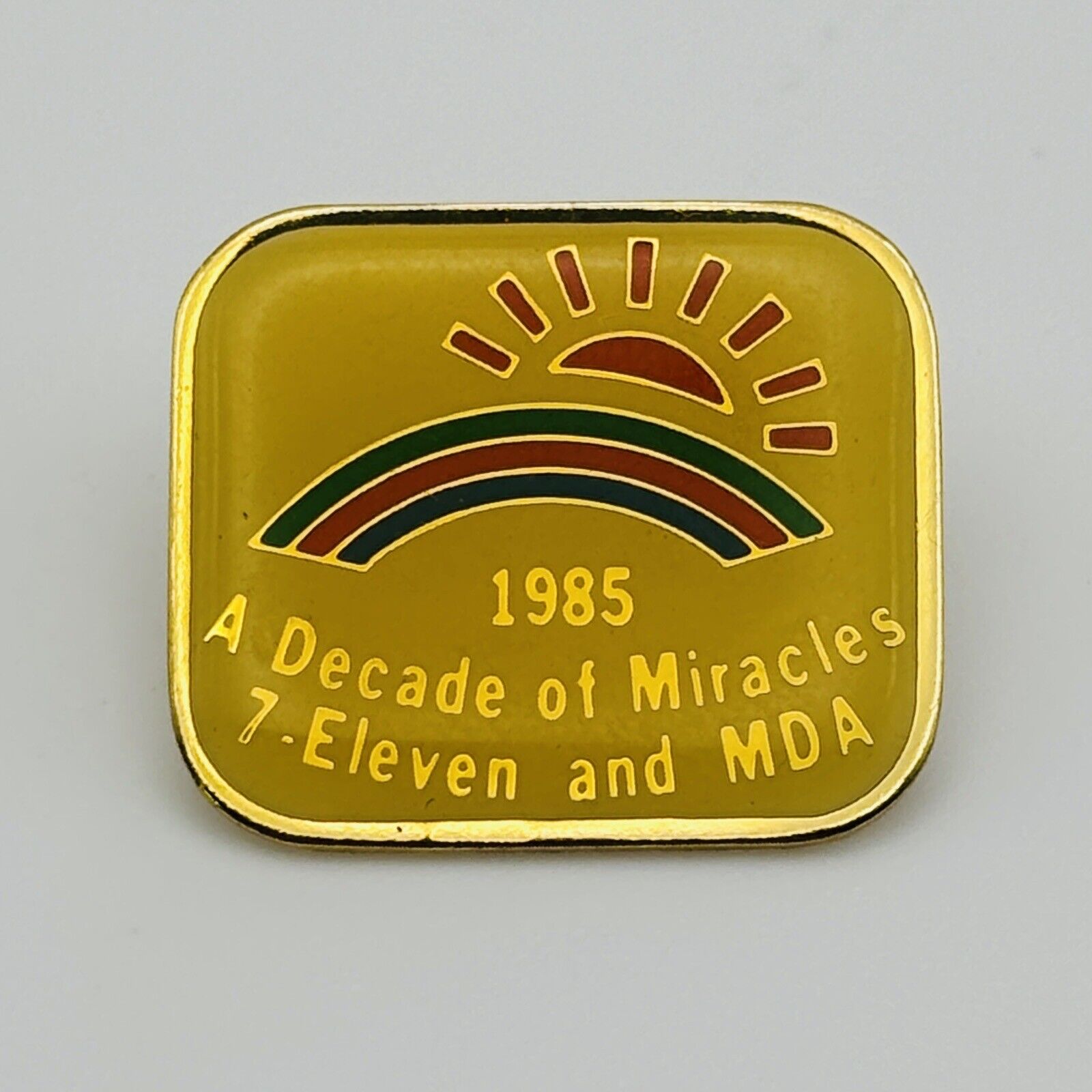 1985 A Decade Of Miracles 7-Eleven And MDA Rainbow Pin - Lapel, Hat - Good Stuff