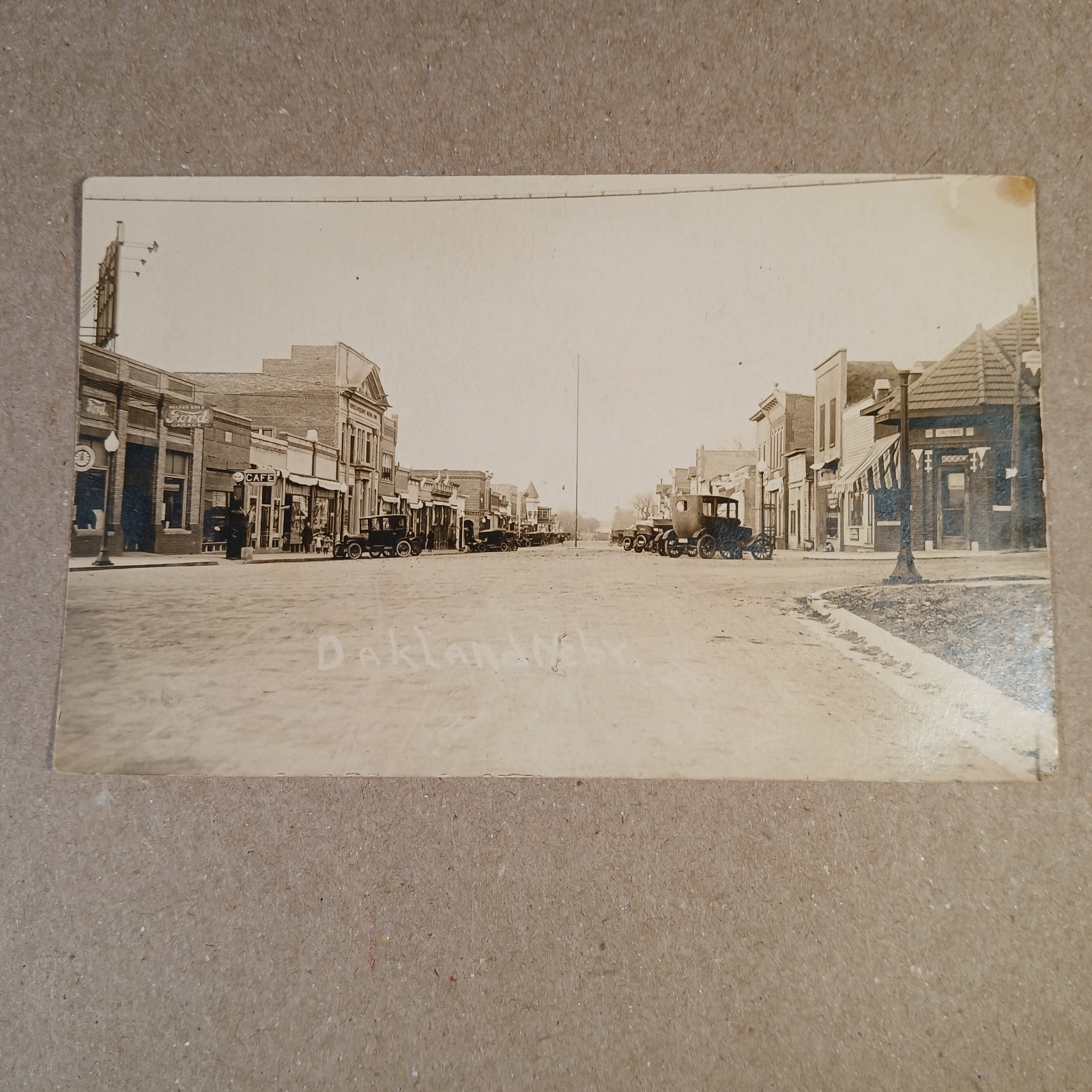 RPPC Oakland Nebraska Main Street Circa 1920\'s Postcard Ford Motors Cars