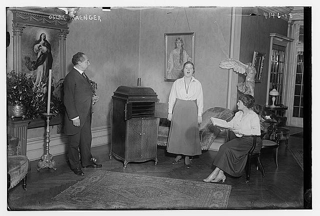 Photo:Oscar Saenger Singing Teacher with Students Interior Scene