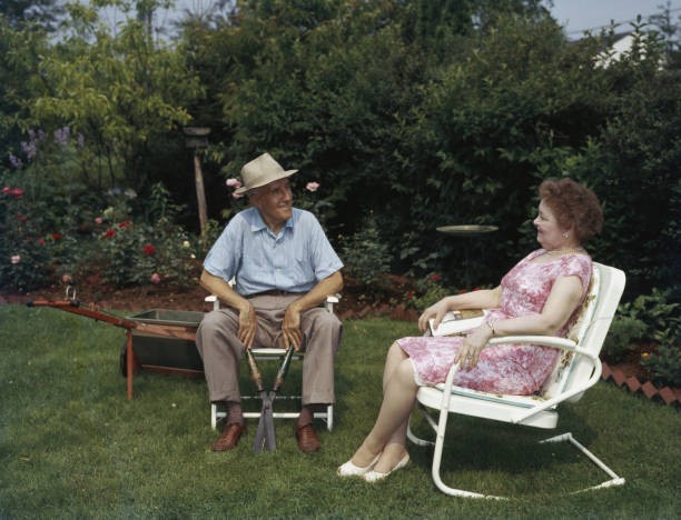 An old man a pair shears takes a break from pruning sit contentedl- Old Photo