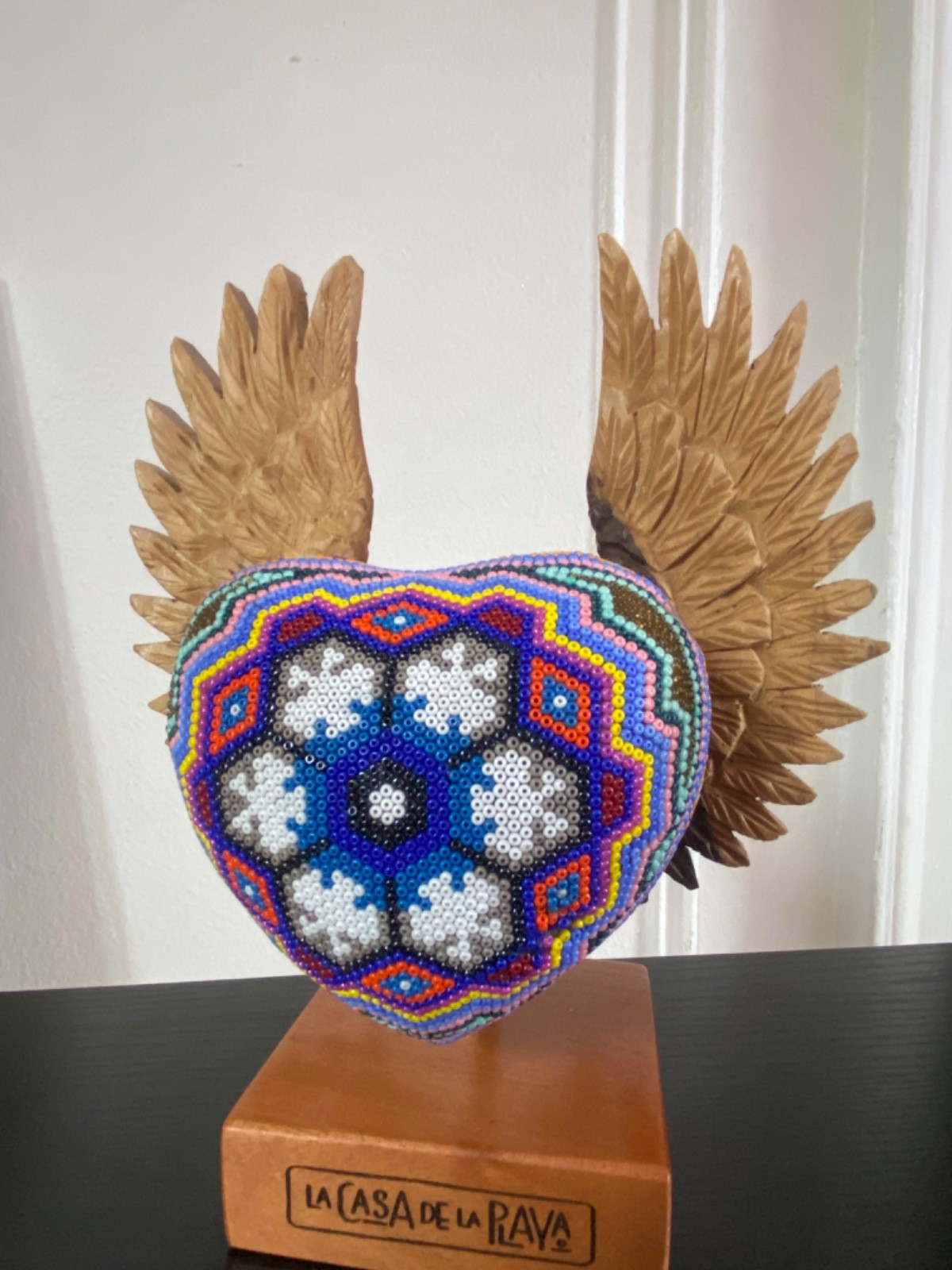 La Casa de la Playa Beaded Heart with Wings Huichol Wooden Stand