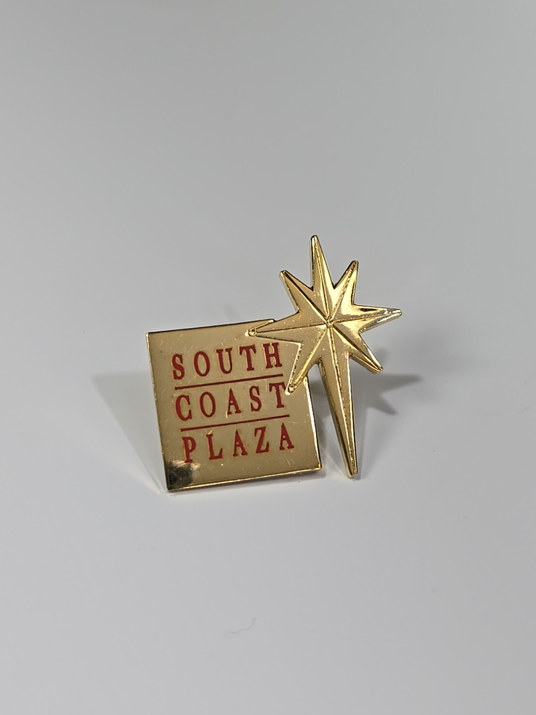 South Coast Plaza Lapel Pin Star With Red Letters & Gold Color Background 
