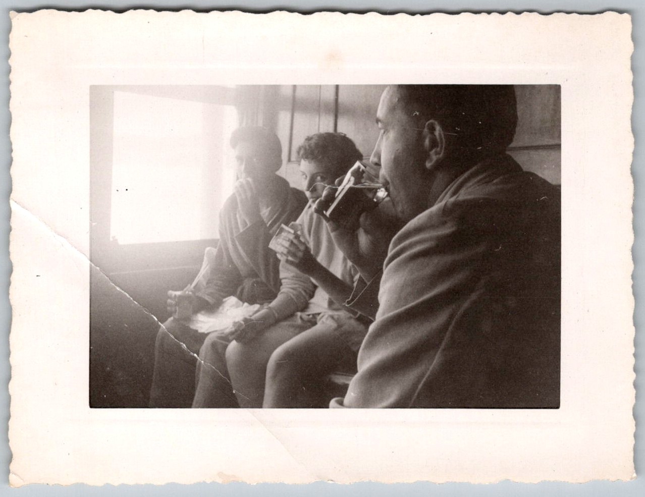 Vtg B&W Snapshot Three Young Men Drinking Eating Snacks Train Interior Window