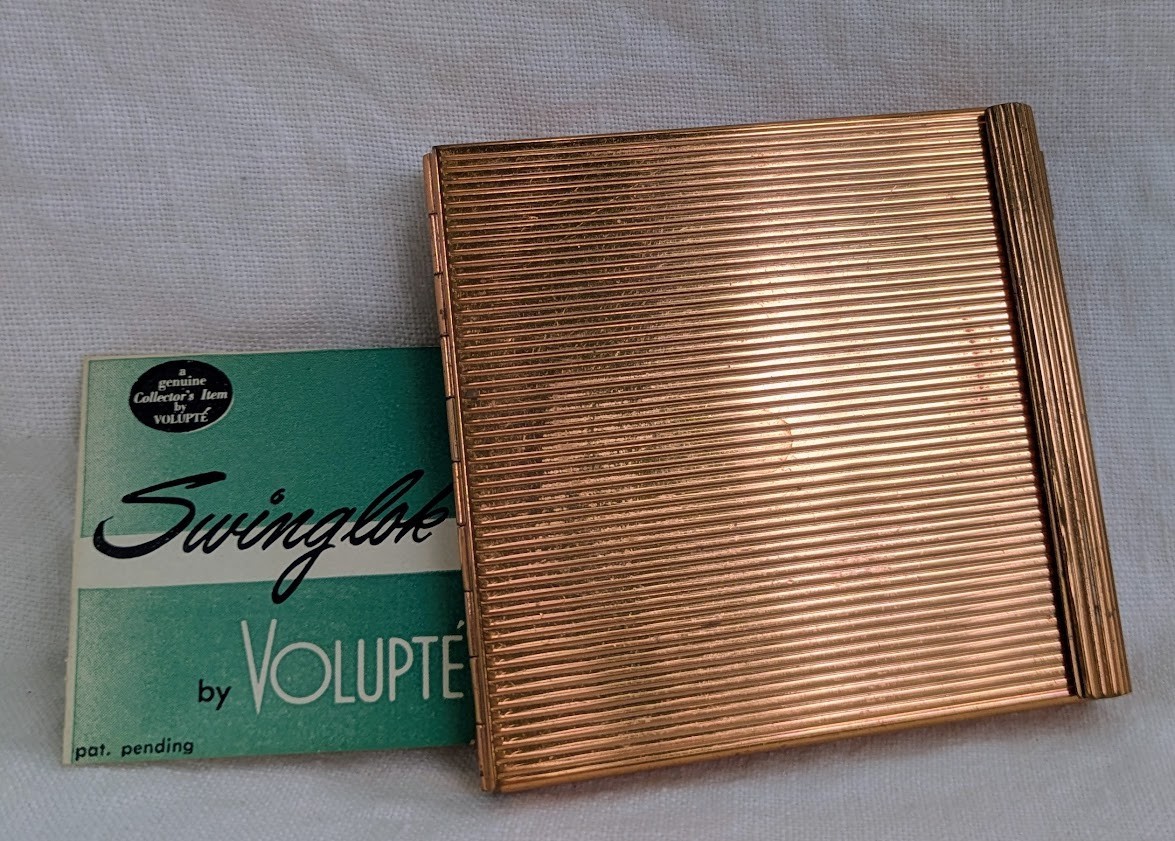 Vintage Volupte Swinglok Compact Gold Tone Unused w/ Puff Booklet Mid Century