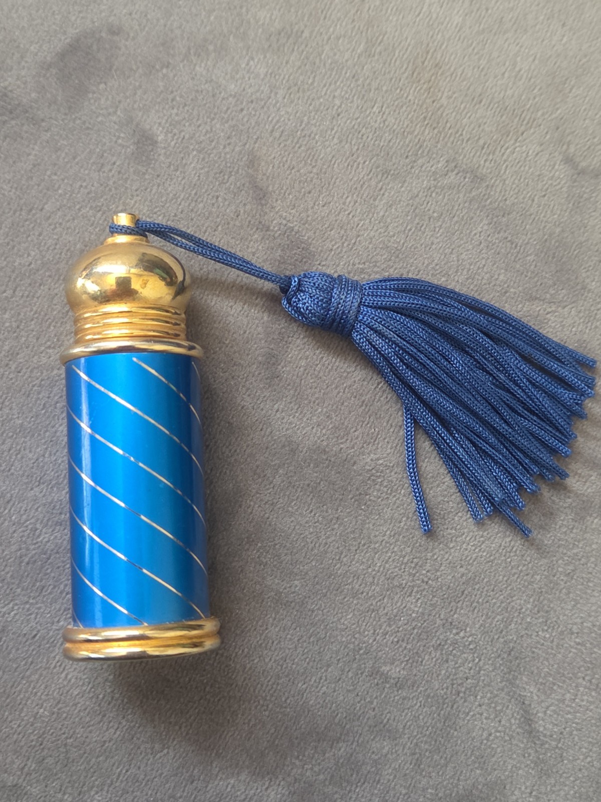 Beautiful vintage-style purse perfume or scent bottle featuring a bright blue...
