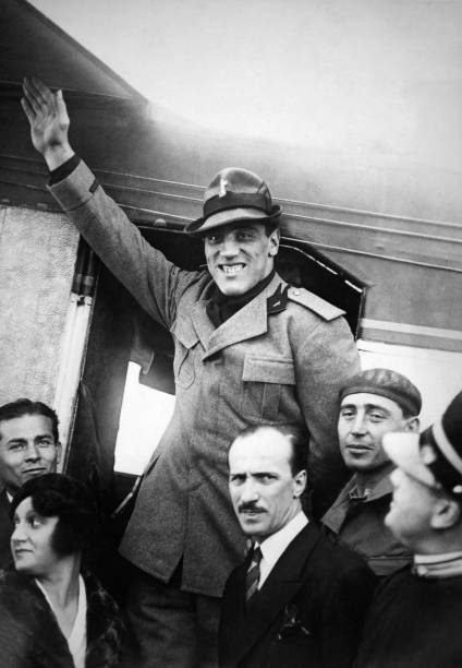 Italian heavyweight boxer Primo Carnera surrounded by supporters w- 1933 Photo