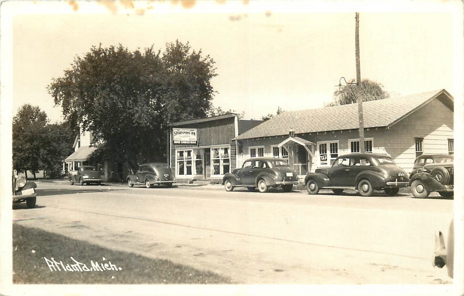 1940s Atlanta Michigan Street Scene autos RPPC Postcard 25-9022