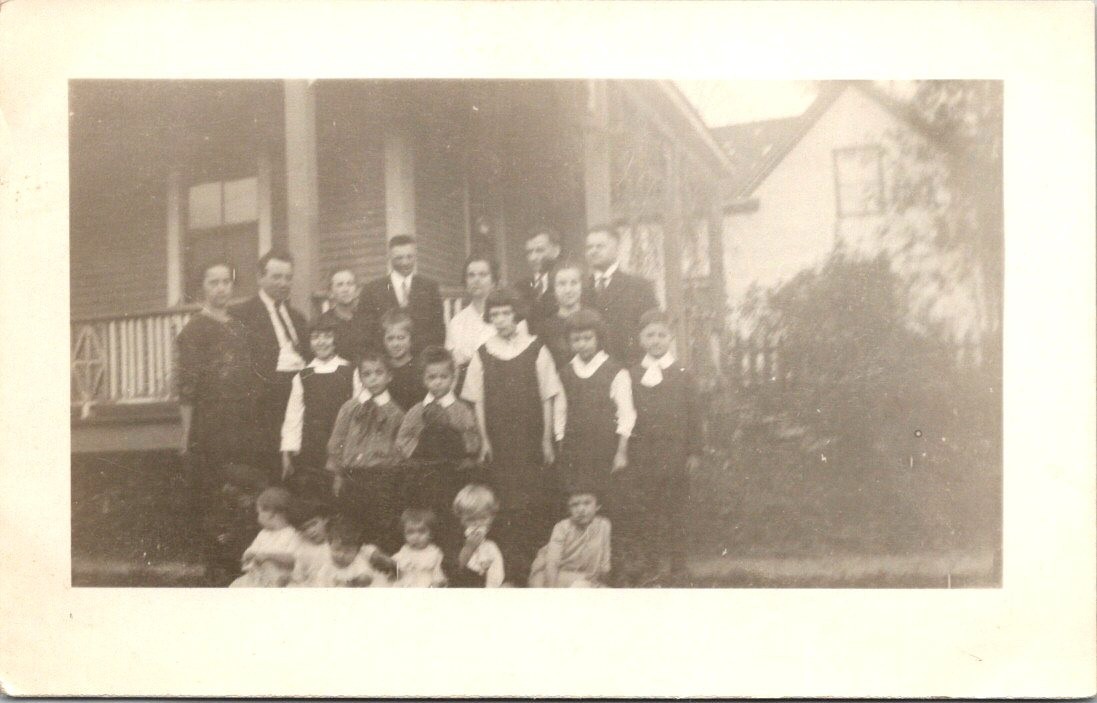 Group Family Photo In Front of Unidentified House c1930s RPPC Postcard