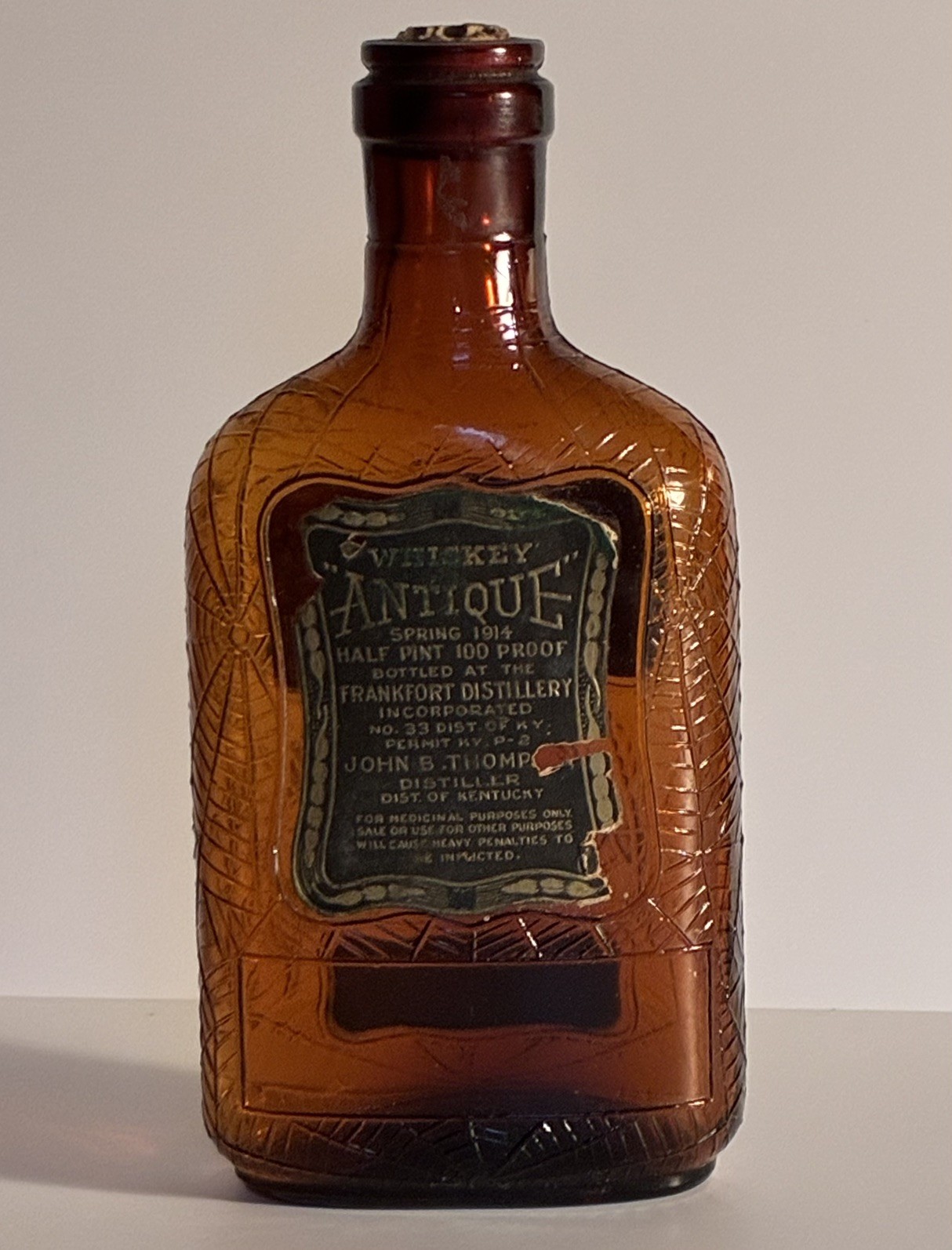 1914 Antique Frankfort Distillery Whiskey Bottle Spider Web 1/2 Pint 100 Proof
