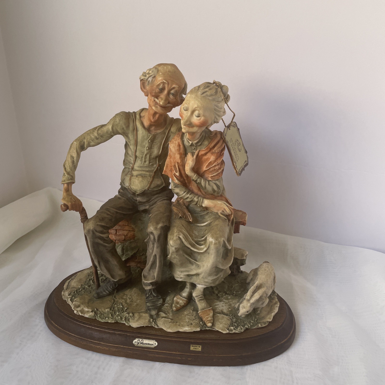 Capodimonte Figurine of an Elderly Couple on a Bench with a Rabbit
