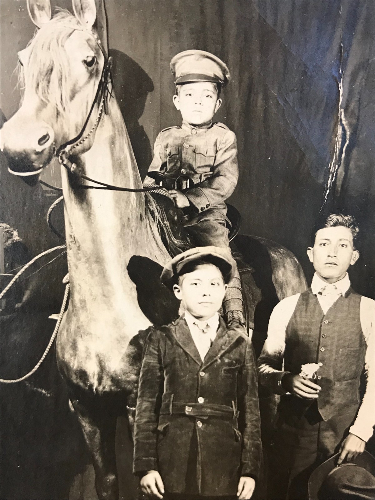 Antique Old RPPC Real Photo Postcard CHILD IN UNIFORM + STUFFED HORSE Weird 30's