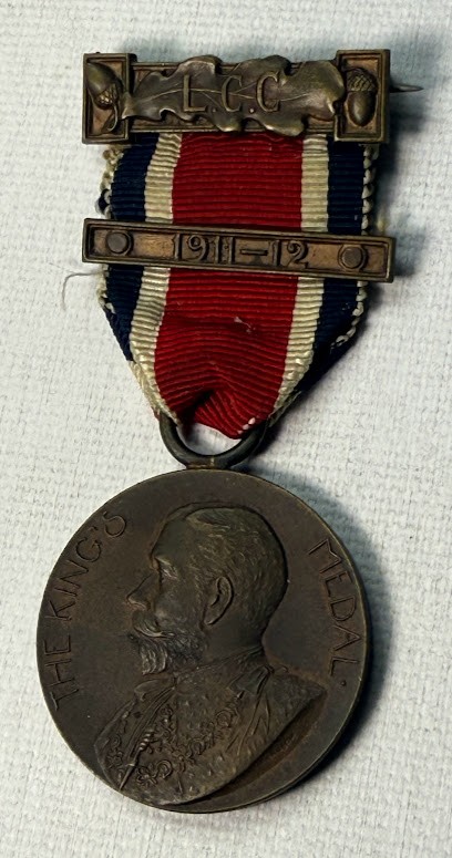 Antique 1911 King's Medal London  with red/white/blue ribbon.