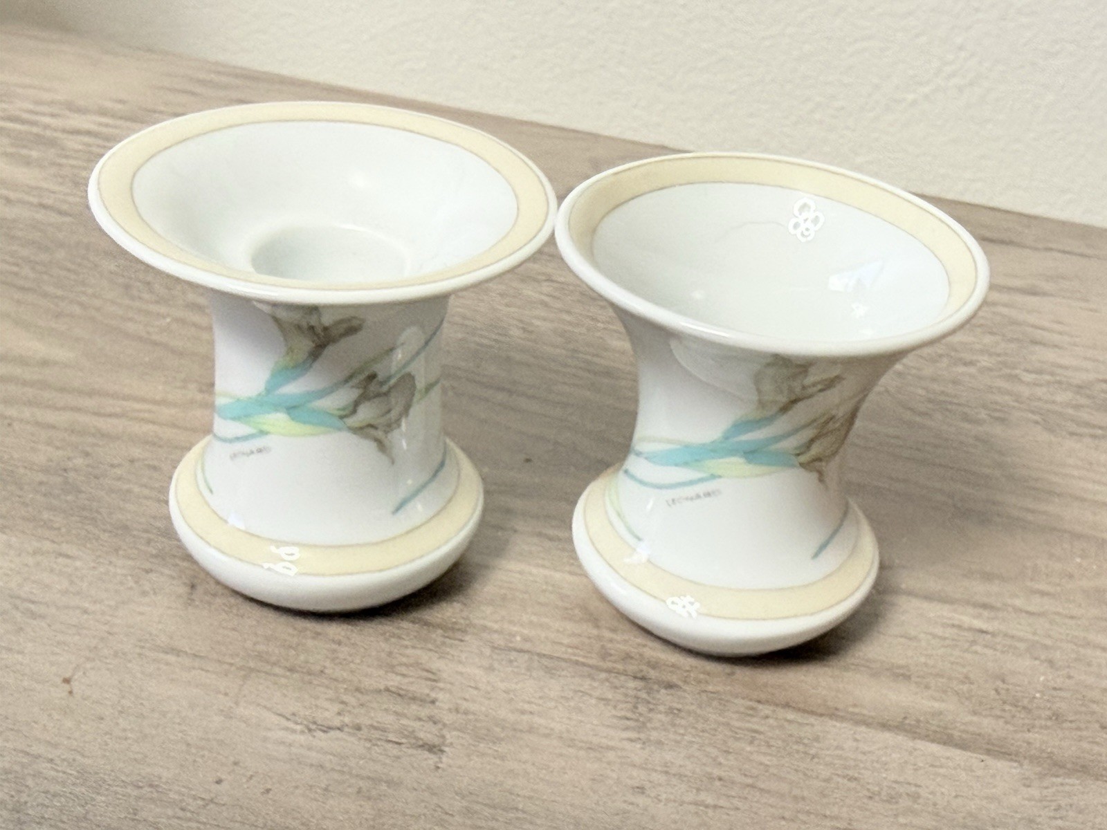 A pair of Hutschenreuther Germany Estoril vases with Leonard Paris decor.