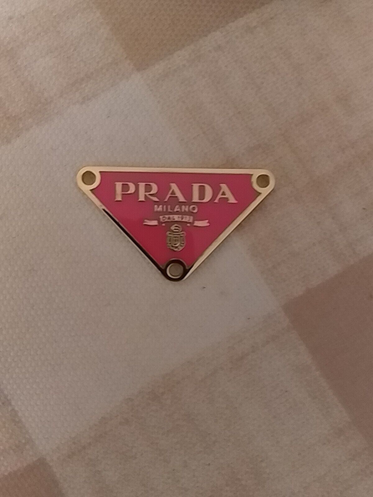 One  Prada Logo Triangle pink with trim  gold tone  Button  Zipperpull