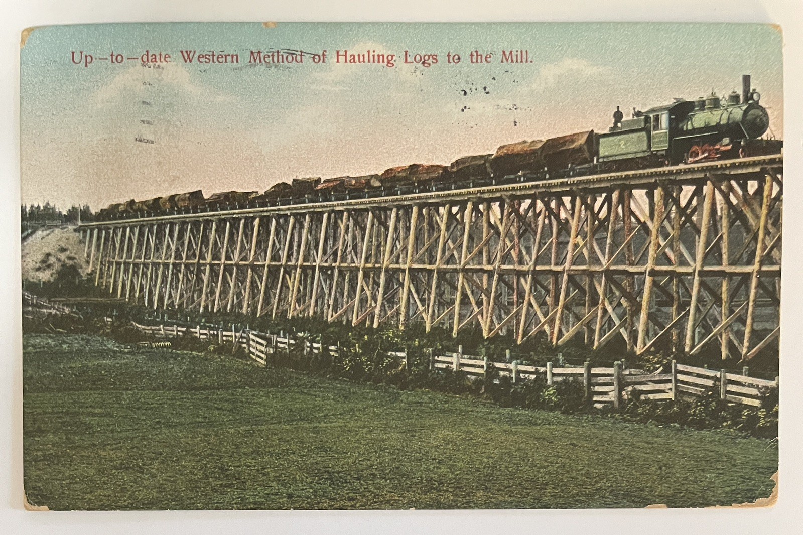 1920 Oakland, California up-to-date, of hauling logs to Mill railroad Bridge