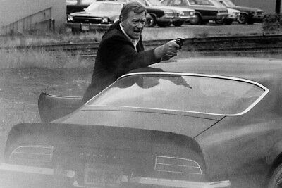 McQ John Wayne pointing gun by Pontiac Firebird Trans Am 24x36 Poster