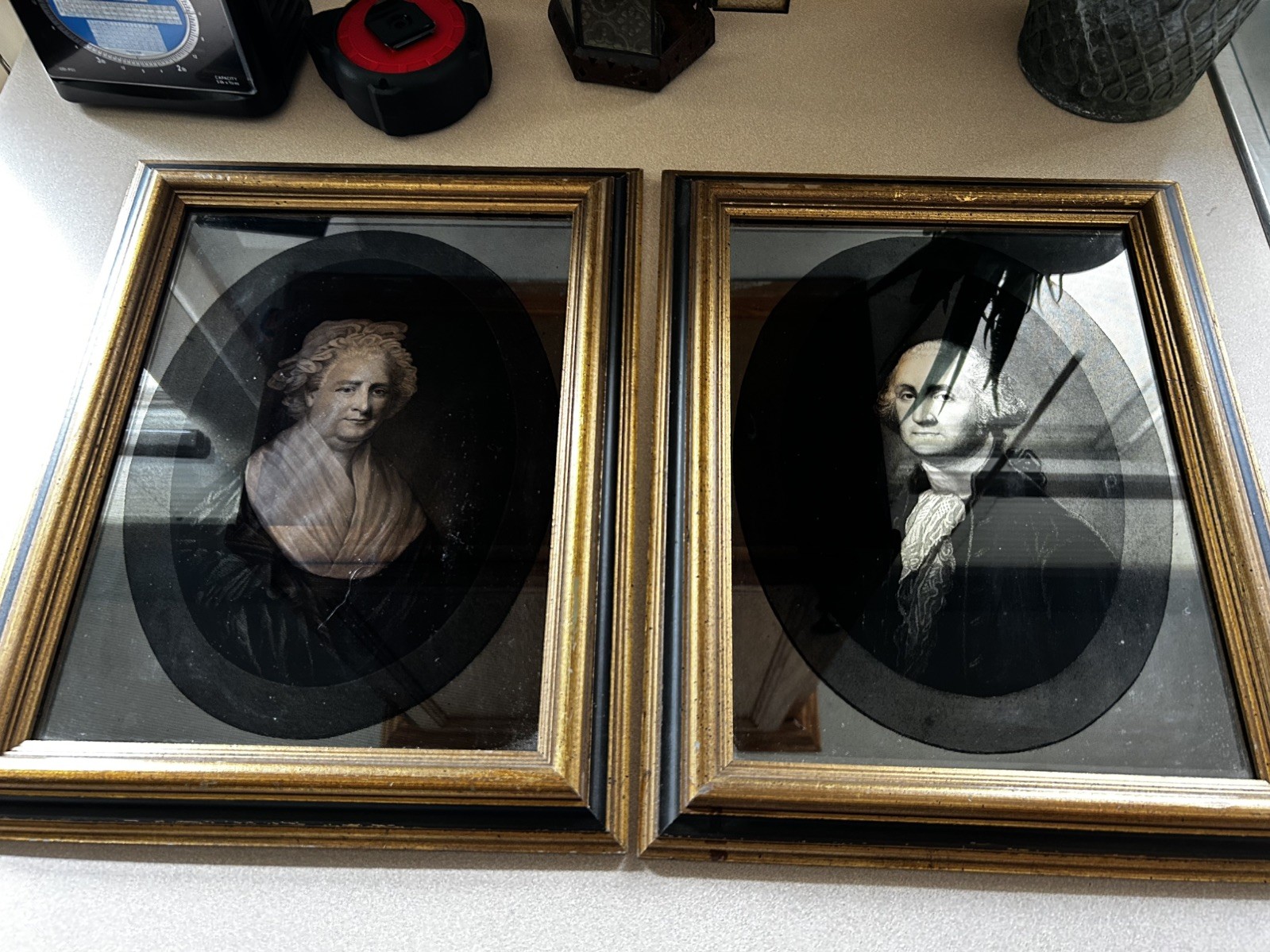 Framed chromolithographic canvas portraits of George and Martha Washington