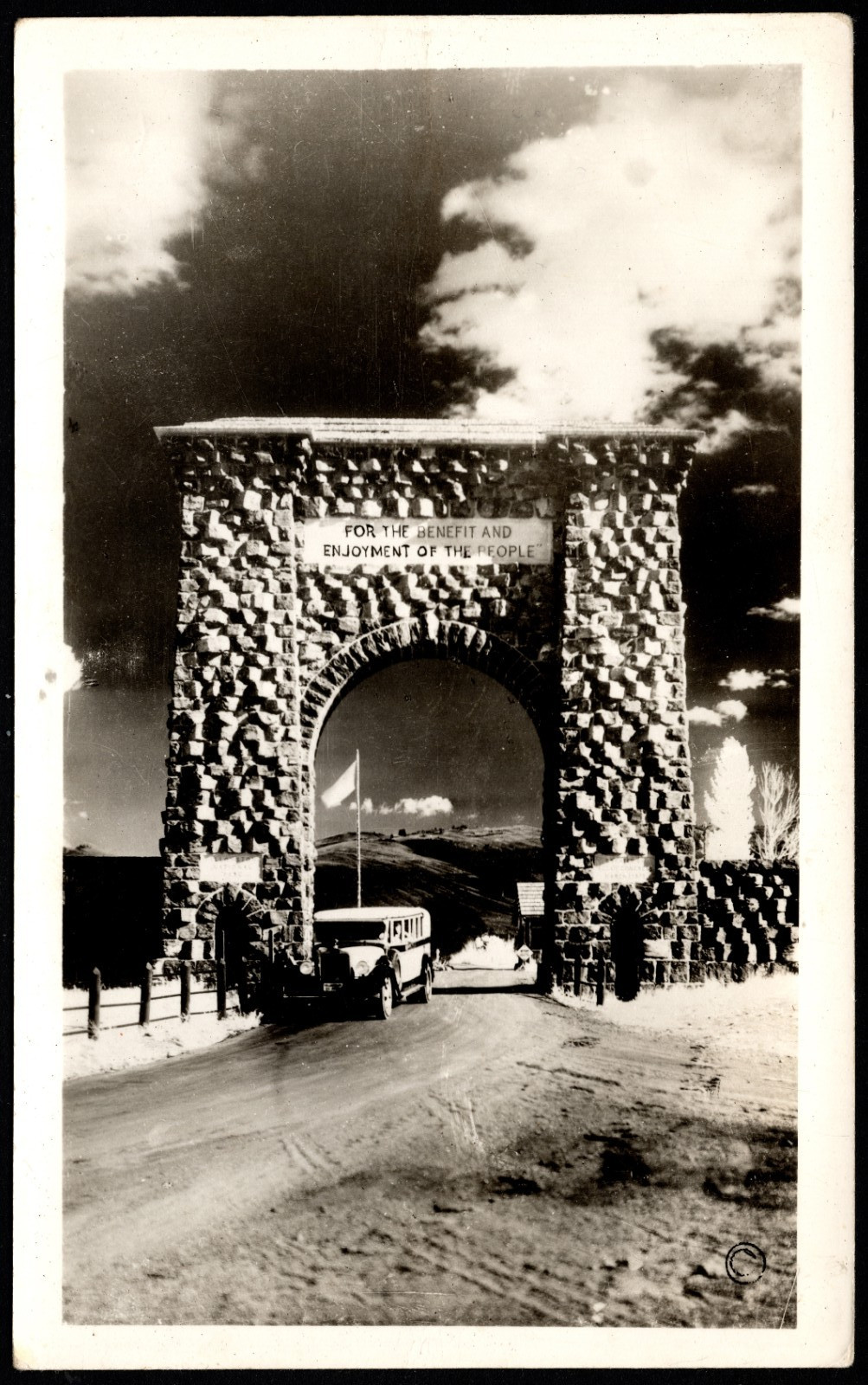 Postcard Yellowstone,Roosevelt Arch and Bus at North Entrance,Gardiner, MT  RPPC