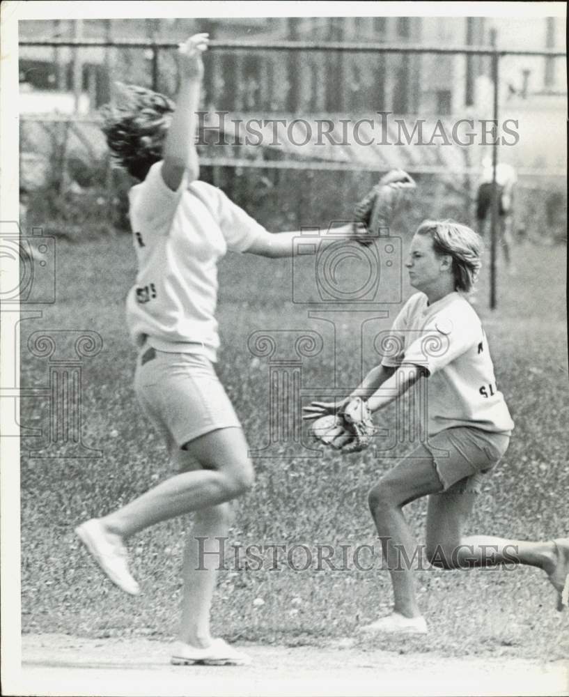 Press Photo Two women go for a ball on a baseball field - nei32106