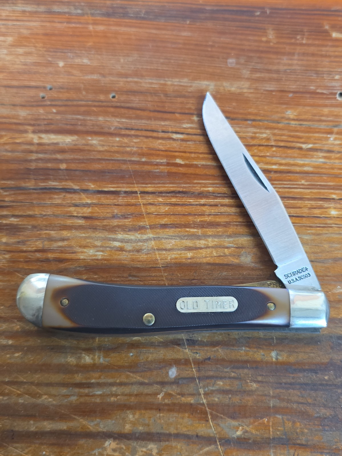 Schrade USA 194OT Gunstock Trapper Knife Carbon Steel Liner Lock Sawcut Delrin