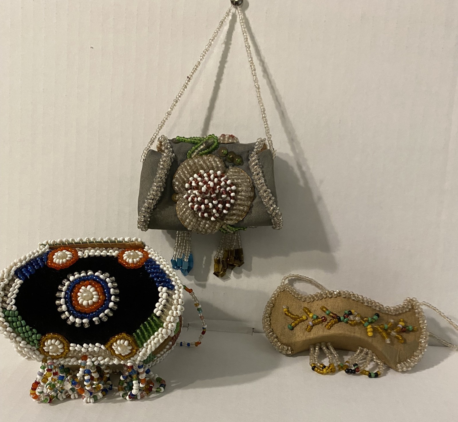 Antique Native American Iroquois souvenir beadwork of two small boxes and canoe