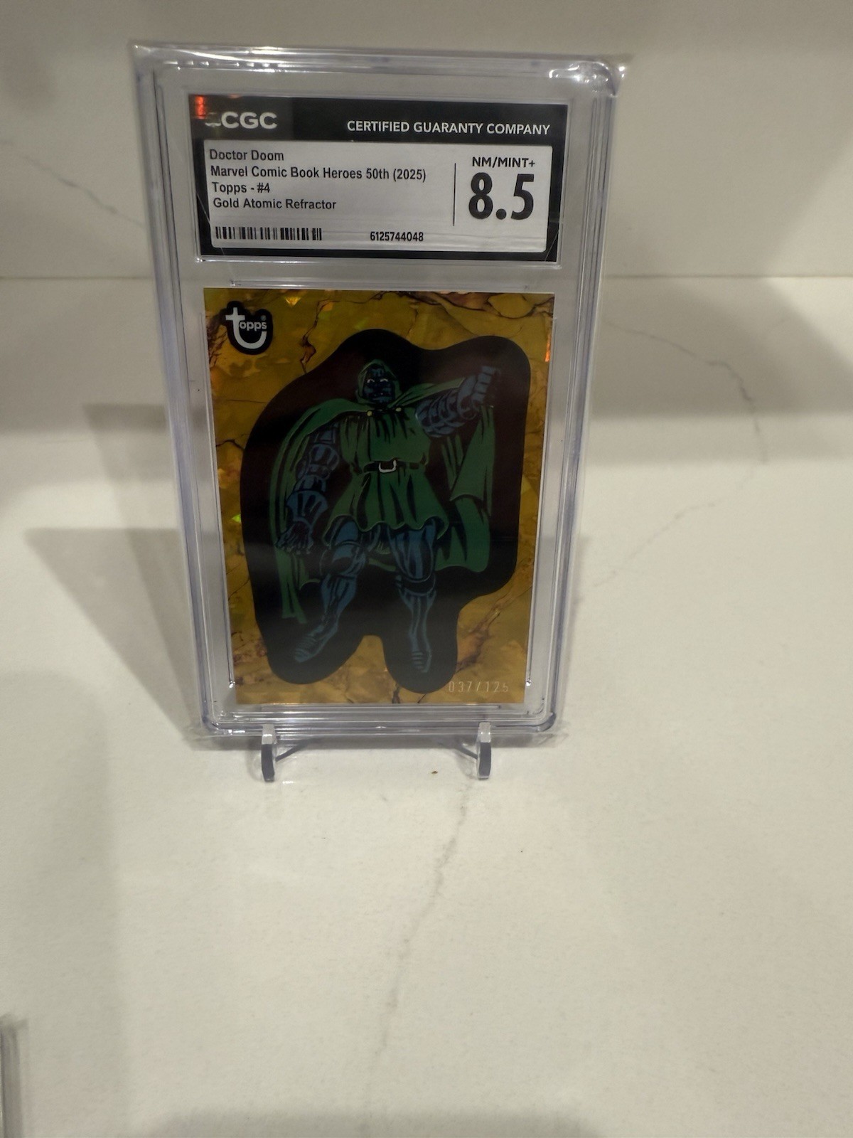 2025 Topps Marvel Comic Book Heroes Doctor Doom Gold Refractor 37/125 CGC 8.5 2025 Topps Marvel Comic Book Heroes Doctor Doom Gold Refractor 37/125 CGC 8.5