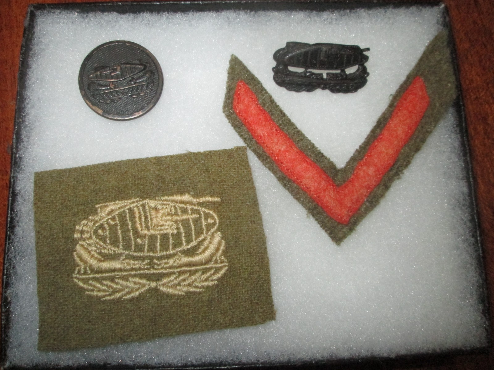 Original WWI U.S. tank corps disc, hat pin, patch, and overseas stripe 