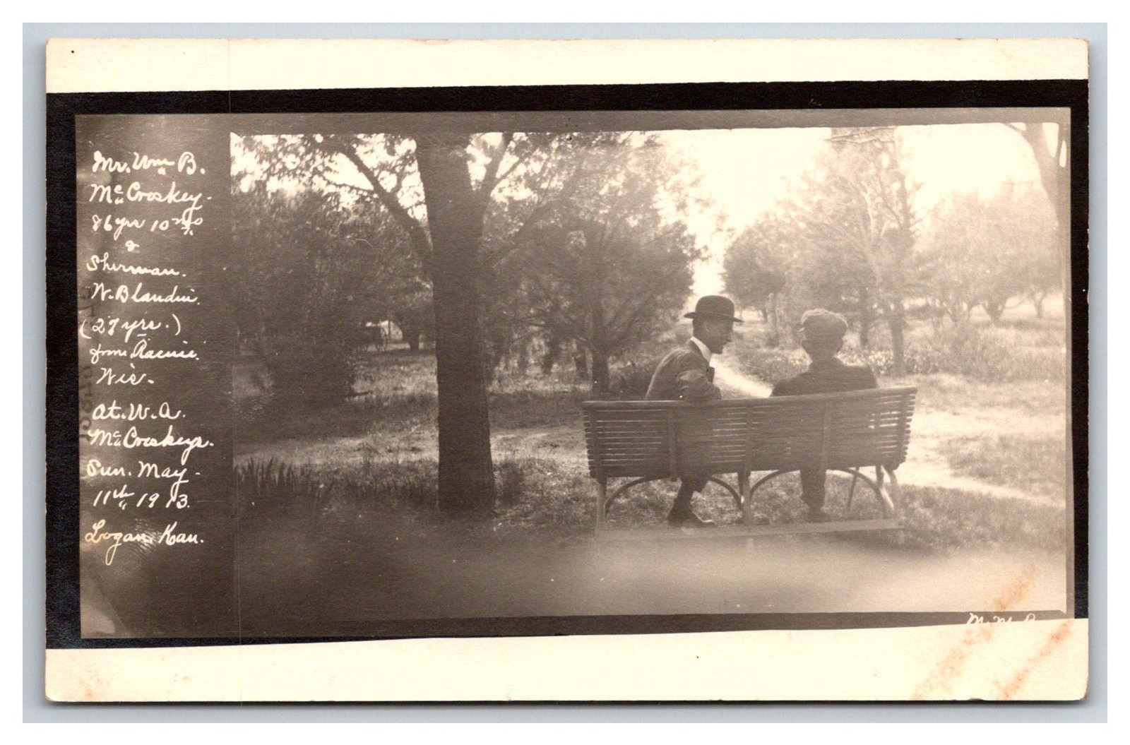 RPPC ~ LOGAN KS ~ Visitors from Wisconsin on Park Bench LOGAN KANSAS