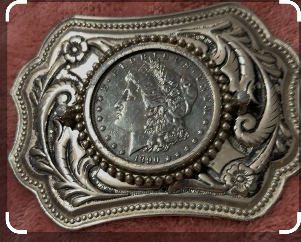 vintage Western-style belt buckle  an authentic or replica Morgan silver dollar