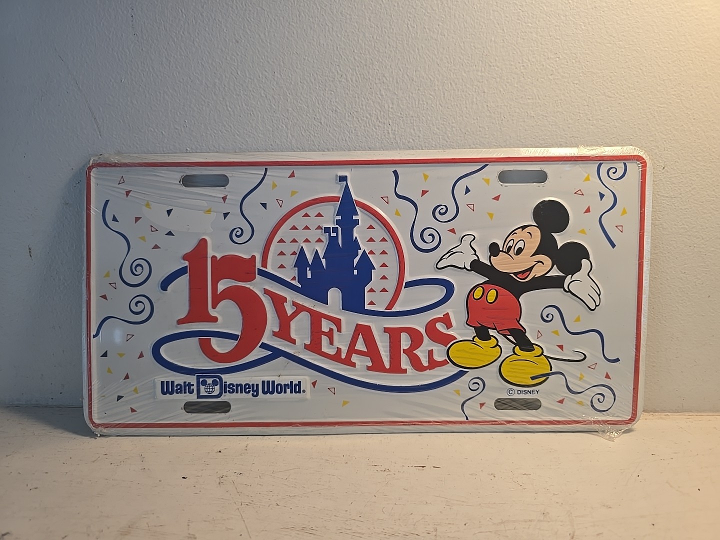 VINTAGE WALT DISNEY WORLD 1986 “15 YEARS” LICENSE PLATE - NEW