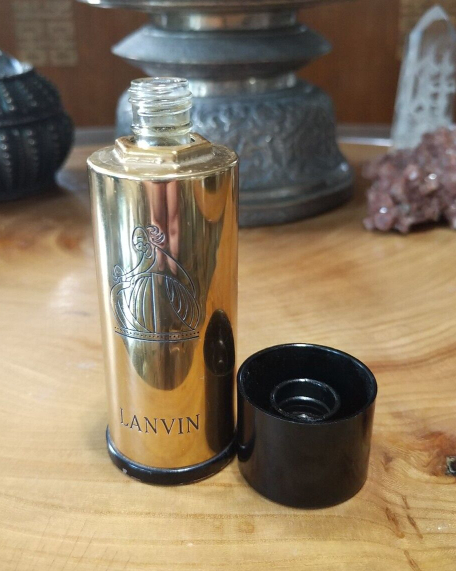 Vintage Lanvin perfume bottle with etched gold toned metal logo