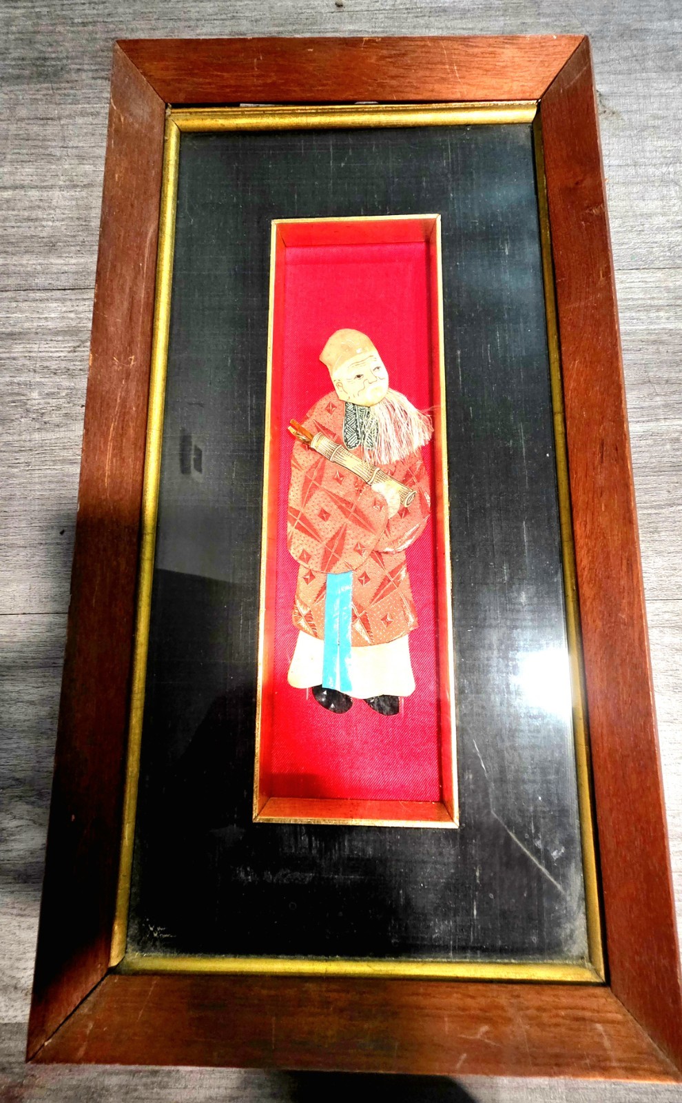 vintage three-dimensional framed fabric wall art piece depicting an elderly...