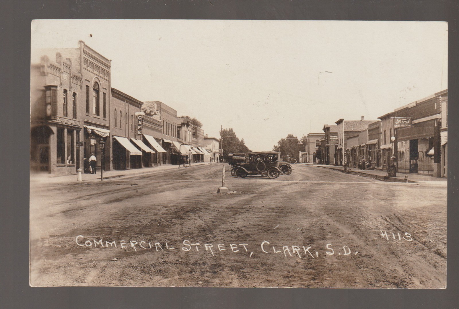Clark SOUTH DAKOTA RPPC c1920 MAIN STREET Stores FORD DEALERSHIP SD