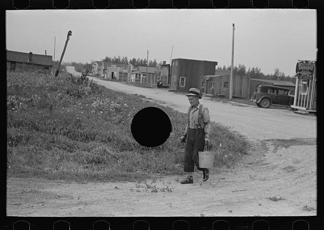 Photo:Minnesota 1937 Boy Carrying Bucket Rural Street FSA Town Scene