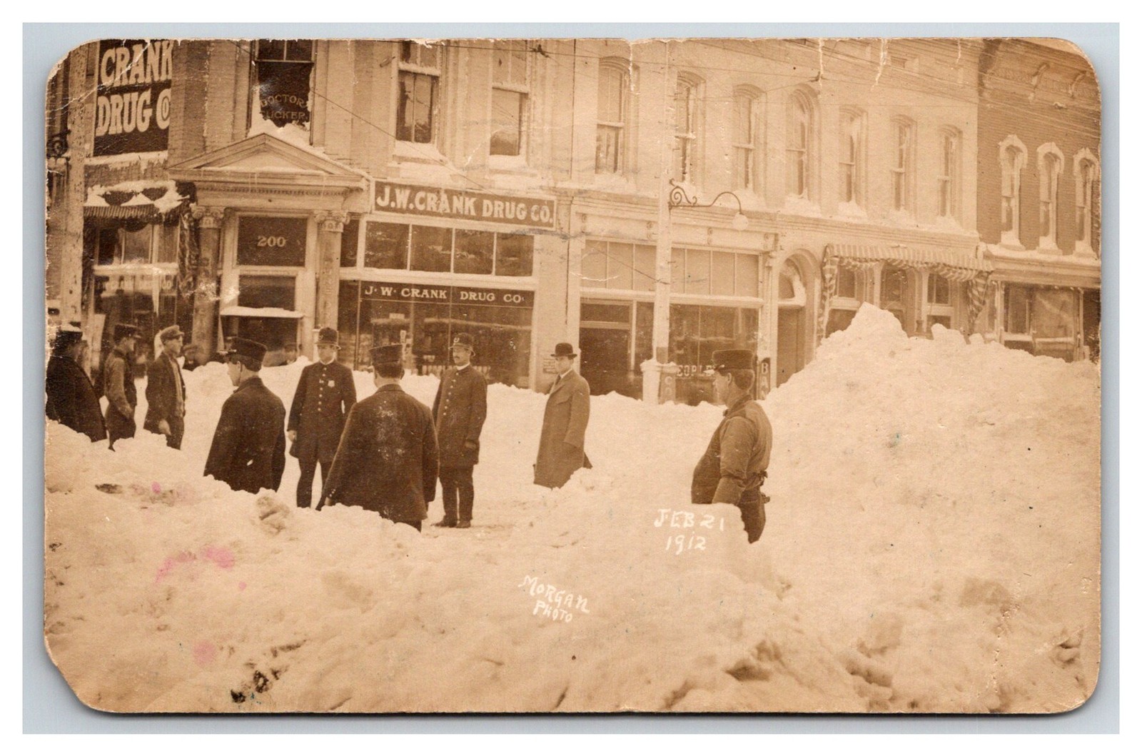 Police & snow filled Street RPPC ~ Springfield Missouri  ~ J.W. Crank drug