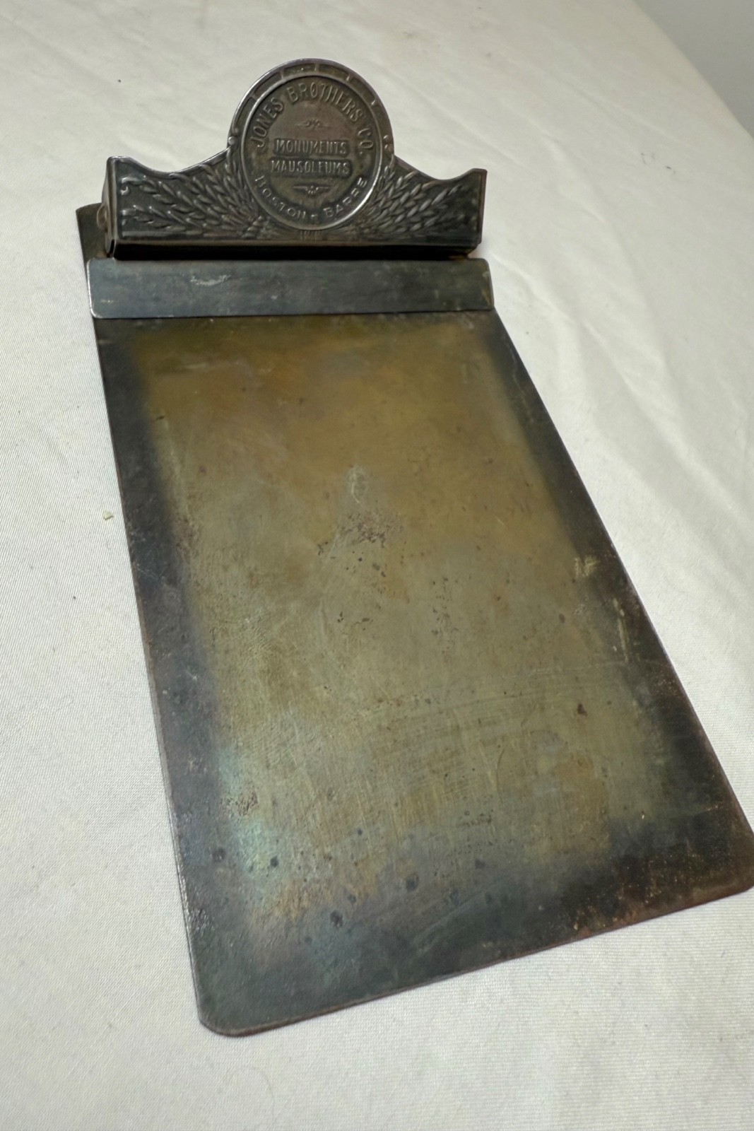 Rare antique oddity Jones Bros Monuments Mausoleums metal paper clip holder