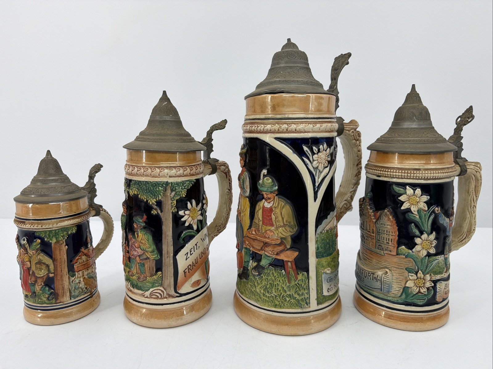 4pc Vintage German Beer Stein Set  with Pewter Lids Lot Of 4