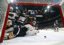 Michael Garnett Atlanta Thrashers watches the puck skip out - Ice Hockey Photo picture