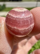 High Quality Gemmy Rhodochrosite Sphere .64 Inches In Diameter. picture