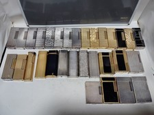 Lot of Gas lighters in need of a lot of repairs picture