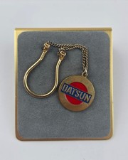 Vintage Datsun Automobile keychain fob gold tone red & blue enamel picture